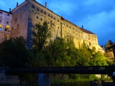 Just a part of the massive castle above the river at dusk