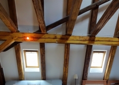 Ancient ceiling timber work in the attic suite of Hotel Švamberský dům