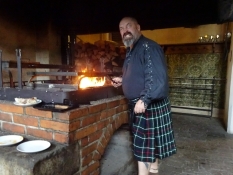 It has also nice cafés, this one with a chef in a folk costume at an open fireplace