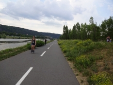 Broad cycle freeway along the river into the Czech capital